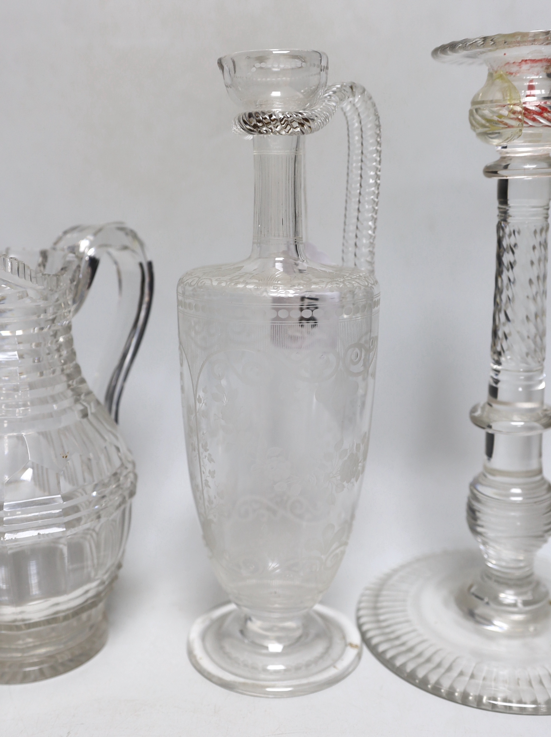 A group of 19th century and later glassware including an Edwardian decanter with floral etched decoration and a pair of glass candlesticks, the largest 29cm high